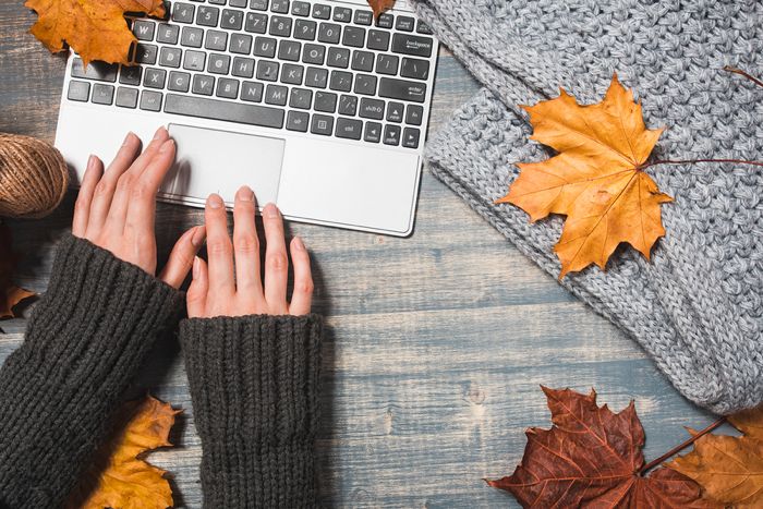 Laptop with fall leaves around it